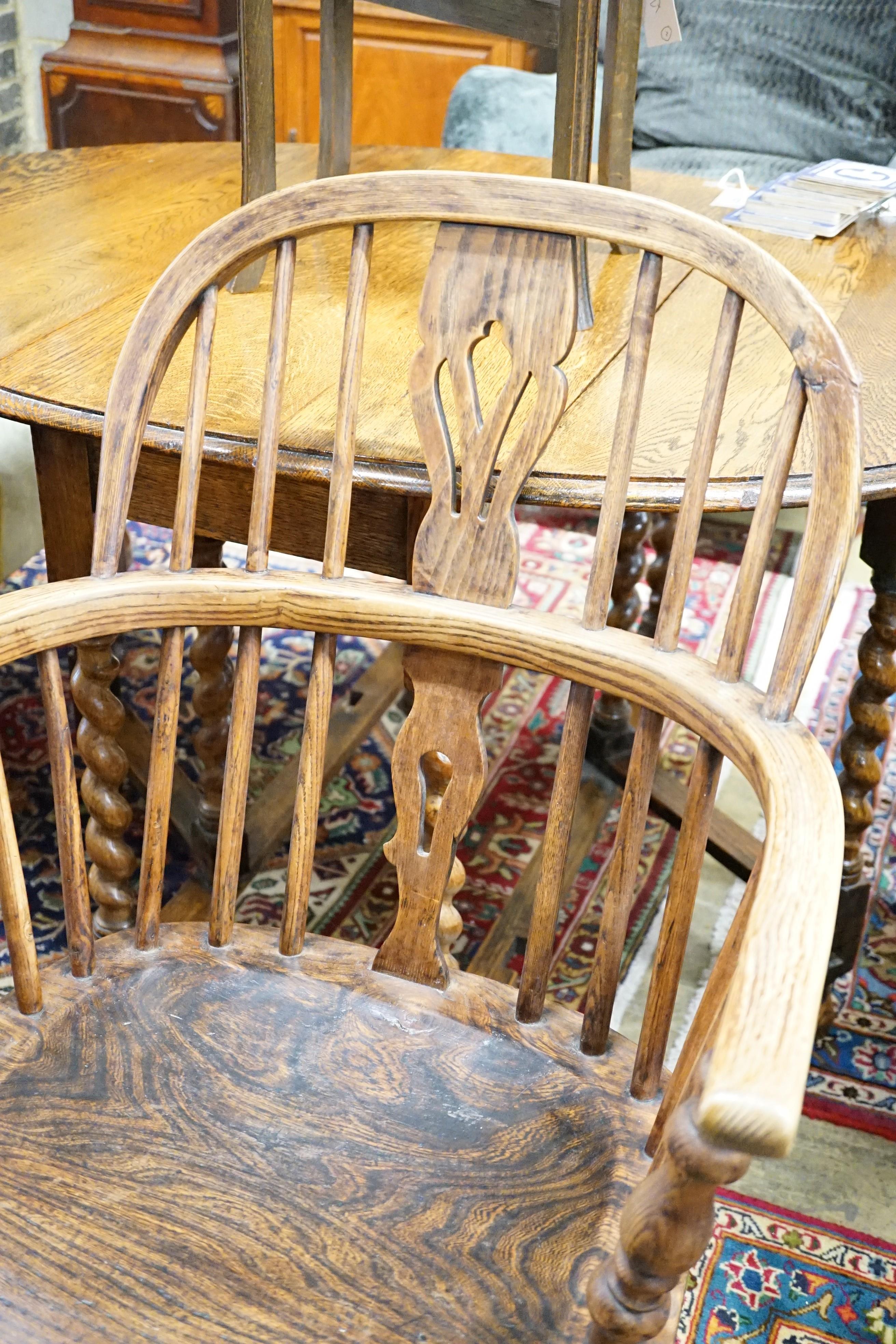 An early 19th century oak, elm and ash Windsor elbow chair, width 57cm, height 94cm